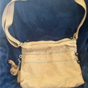 Kipling Tan Crossbody Bag with Adjustable Strap and Relaxed Design